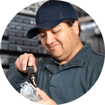 a male maintenance worker working with a screwdriver